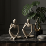 Abstract Thinker Figurines in Dark Luxury Setting