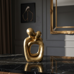 Close-up of gold couple ornament