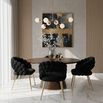 Four black dining chairs around Bella dining table