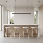 Four white bar stools in contemporary kitchen
