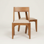 Front close-up of mango wood chairs on neutral background
