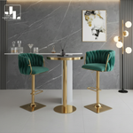 Gold cocktail table with emerald green velvet bar stools