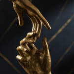 Gold hand sculpture close-up