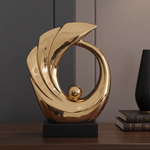 Gold wave sculpture close-up in luxury setting