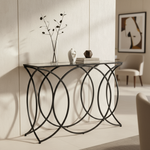 Mirrored console table with black metal frame in contemporary interior