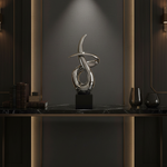 Silver Abstract Sculpture in Dark Luxury Interior