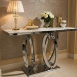 Silver chrome console table with circular ring base in luxurious interior