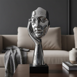 Silver listening statue close-up in luxury setting