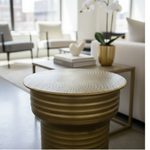 Textured gold side table in modern setting